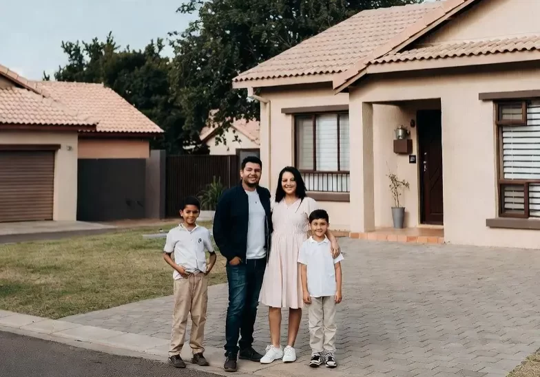 family outside house